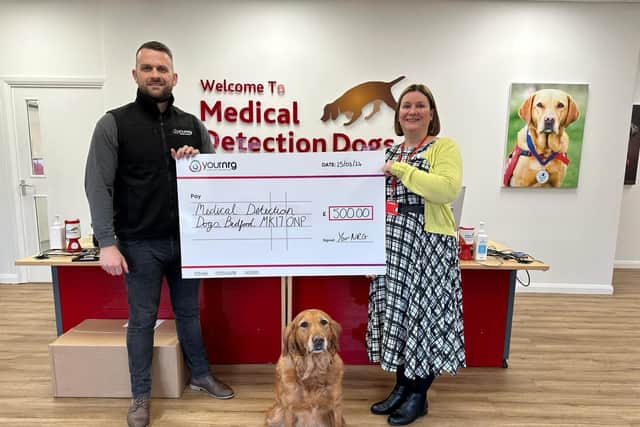 Adam from Your NRG with the cheque of £500