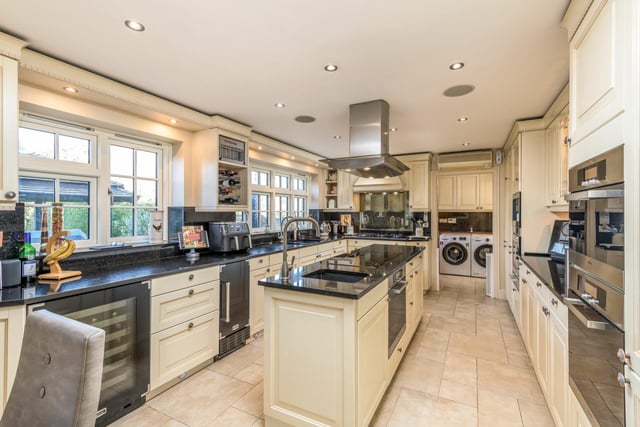 For a keen baker or cook, the kitchen has all you could ever need. There’s extensive cabinetry and a central island, granite worktops, two sinks and Miele and Bosch appliances including fridges, a freezer, a dishwasher, a five-ring gas hob, and induction hob