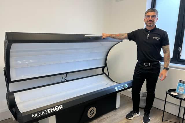 Director and chief pharmacist at NutriZen Zed Mountford-Hill pictured next to a NovoTHOR red light bed