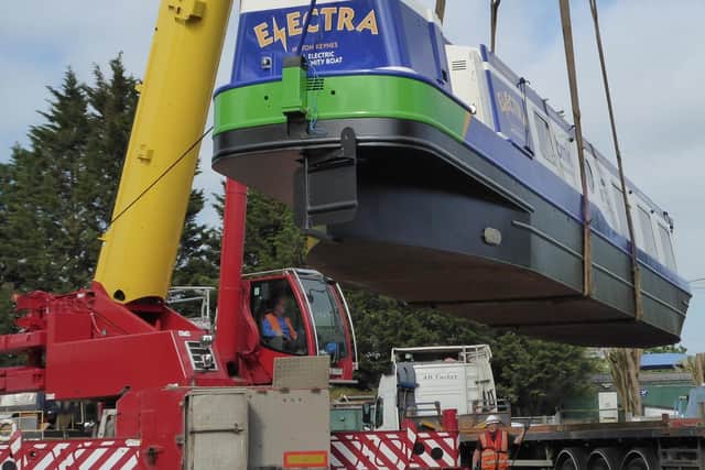 Electra the community boat was winched into the water in MK  ready for the summer cruise season