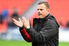 Richie Wellens applauds supporters after the win over MK Dons. Picture: Andrew Roe/AHPIX