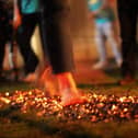 Volunteers are needed to walk barefoot through fire to raise cash for a charity in Milton Keynes