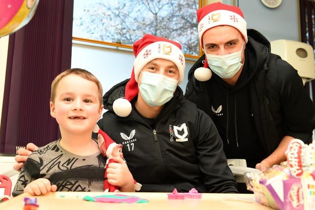 Dan Kemp and Jack Tucker with a young fan