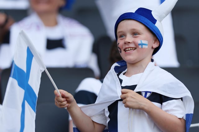 A young Finland fan shows their support during the game