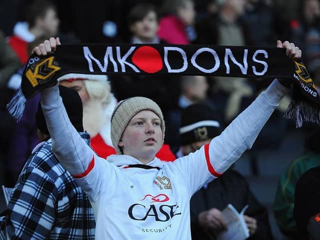 A young MK Dons fan looks on during the FA Cup match between MK Dons and AFC Wimbledon at StadiumMK on December 2, 2012.