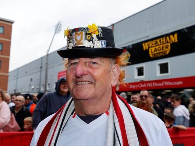 MK Dons took more than 10,000 fans to League Two away games during last season.