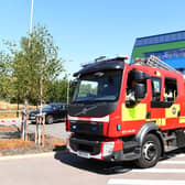 Firefighters tackle a car fire in Milton Keynes. Photo: Jane Russell/National World