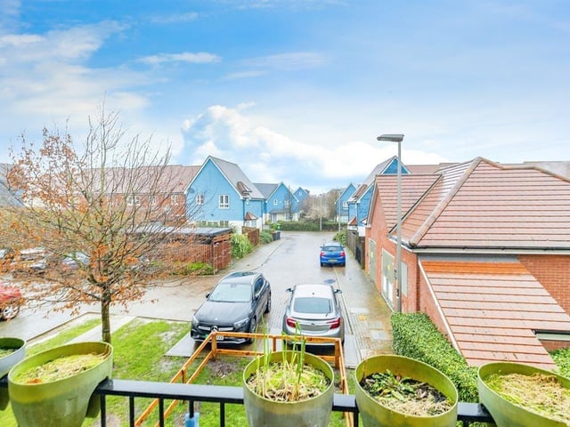 The bedroom balcony overlooks the charming residential area of Middleton.