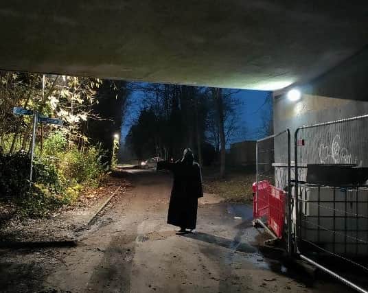 The robed figure walks away from the scene of graffiti crime in Milton Keynes