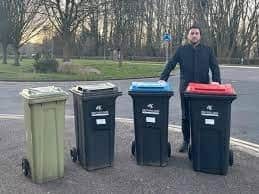 MK City Council leader Pete Marland shows how many wheelie bins each household will have