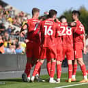 MK Dons celebrate Matt Smith's first goal for the club as he fired the visitors ahead at the Kassam Stadium