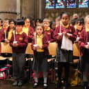 Children held lit candles for the final hymn