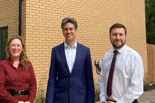 Ed Miliband with Cllrs Pete Marland and Emily Darlington outside the new homes