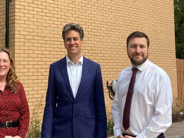 Ed Miliband with Cllrs Pete Marland and Emily Darlington outside the new homes