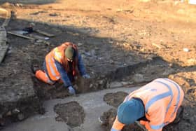 The Oxford Archaeology team cleaning the mosaic. Picture by Angle Property.