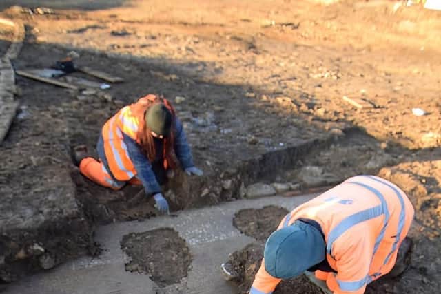 The Oxford Archaeology team cleaning the mosaic. Picture by Angle Property.