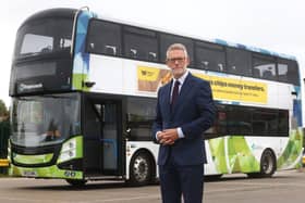 Darren Roe and an electric bus