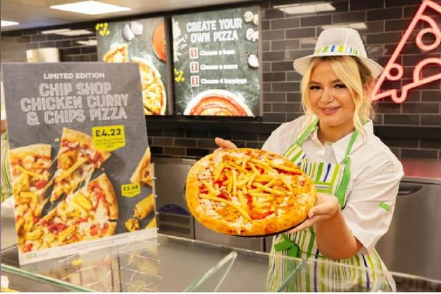 Destiny Harold, AKA the iconic Chip Shop Diva, with the new chicken curry and chips pizza at Asda
