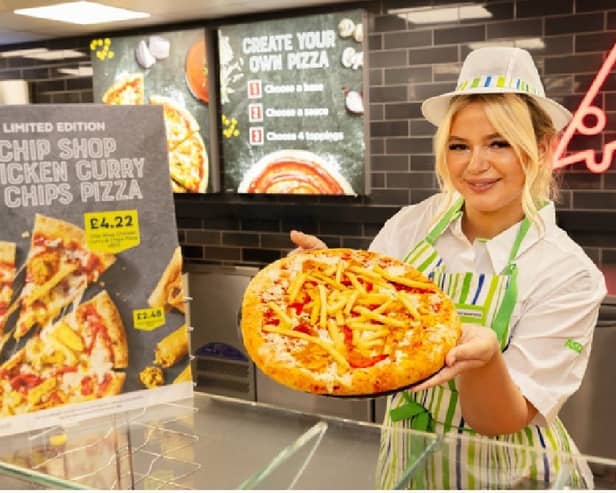 Destiny Harold, AKA the iconic Chip Shop Diva, with the new chicken curry and chips pizza at Asda