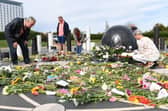 More and more flowers for the Queen are being added daily at MK Rose