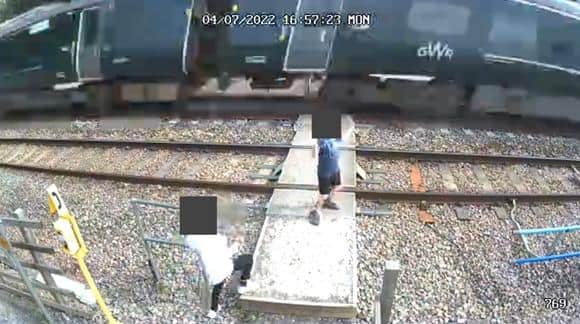 The children appeared to be dancing on the track as a 125mph train approached