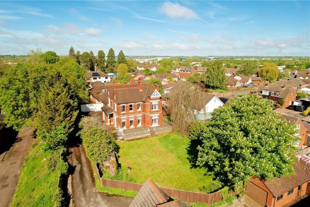 An aerial view of this stunning property and grounds which offers perfect spacious living accommodation, double garage and parking for six cars