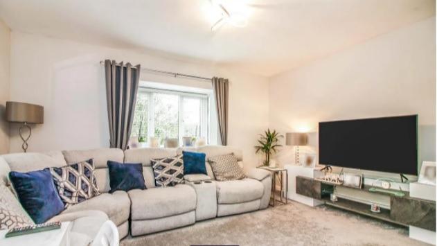 The living room in the property, which opens out into the re-fitted kitchen.