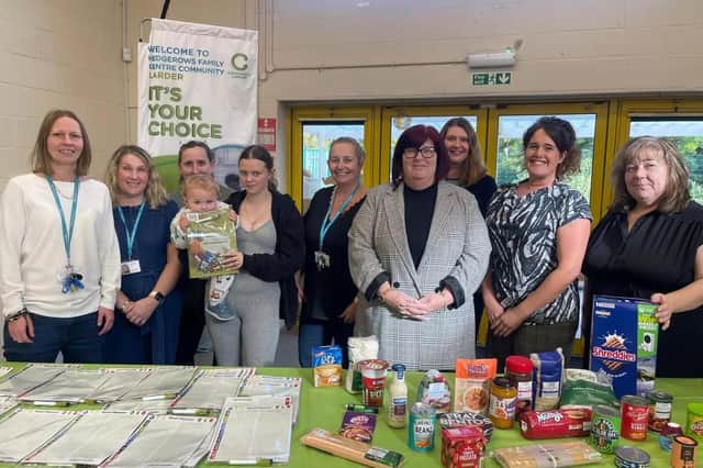 Cllr Fuller with Family Centre staff, volunteers and families at the new Netherfield food larder