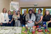 Cllr Fuller with Family Centre staff, volunteers and families at the new Netherfield food larder