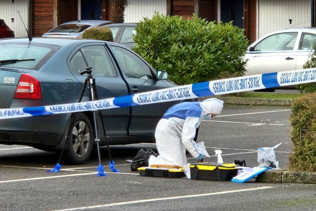 Forensic officers were still at the scene of the stabbing at Wolverton Mill today