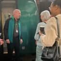 Jon Brett speaks to passengers following one of his unique railway talks