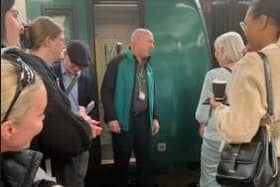 Jon Brett speaks to passengers following one of his unique railway talks
