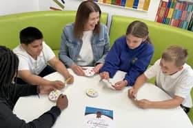 Assistant Headteacher Emily Woods with pupils during a lesson at Langland Community School