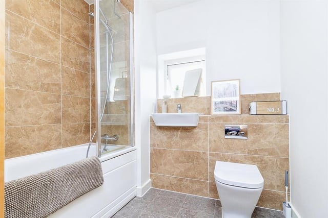 The family bathroom is fitted with bath with mixer taps and shower , wash hand basin, wc, extractor fan and radiator