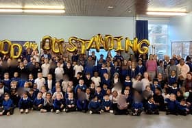 The whole of Langland Community School is pictured celebrating their fantastic 'Good' and 'Outstanding' Ofsted rating.