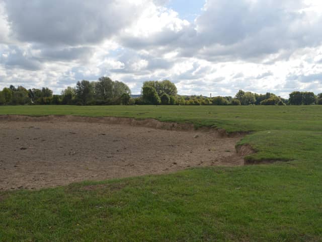 The large crater in this Woolstone field is still visible today