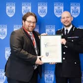 Chief Constable Jason Hogg presents Chris Geraghty with his award