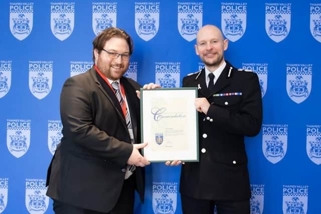 Chief Constable Jason Hogg presents Chris Geraghty with his award