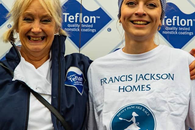 Olney Pancake Race winner Eloise Kramer, pictured with celebrity chef Lesley Waters