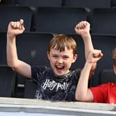 Two youngsters celebrate a goal