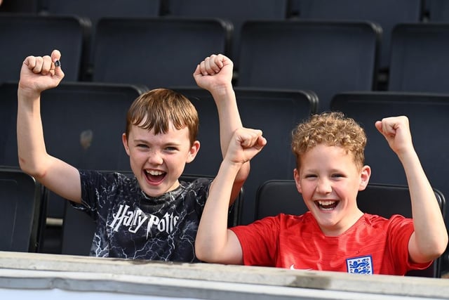 Two youngsters celebrate a goal
