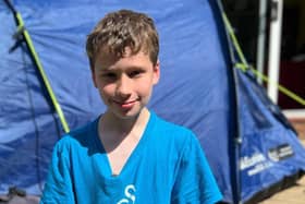 Joshua Fuller, 11, has been sleeping in his tent for year