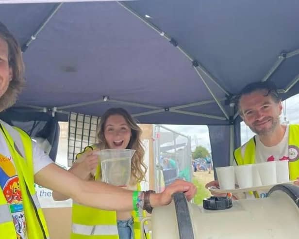 Lewis Simonds, left, from Milton Keynes is helping at the Church of Glastonbury, which is based on the site of the world-famous music festival