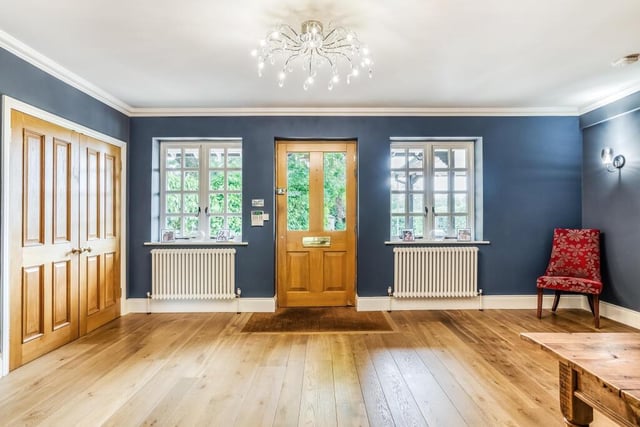 Talk about making an entrance - how about this for a hallway with feature Georgian style windows, wooden flooring and doors.