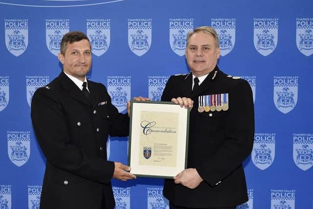 PC Richard Fenemore receives his award from Chief Constable John Campbell