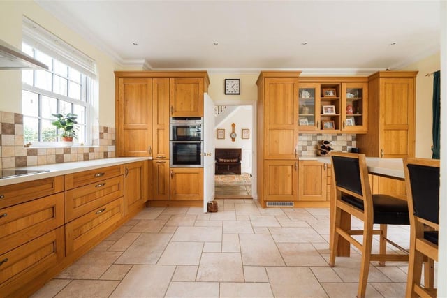 The luxury kitchen also benefits from a tiled floor with electric underfloor heating and sash windows to the front, side and French doors opening to the rear garden.