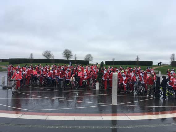 135 residents, including the deputy mayor and councillors, donned Santa suits for the cycle. Photos: Jane Russell