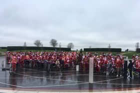 135 residents, including the deputy mayor and councillors, donned Santa suits for the cycle. Photos: Jane Russell
