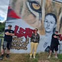 Fundraiser Bonny Cook pictured with the artists MrMeaner and Gnasher after the Newport Pagnell mural was re-painted over the weekend