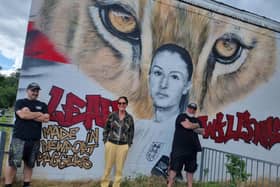 Fundraiser Bonny Cook pictured with the artists MrMeaner and Gnasher after the Newport Pagnell mural was re-painted over the weekend